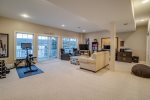 Lower level Family room with patio doors to the outside and steps to the dock